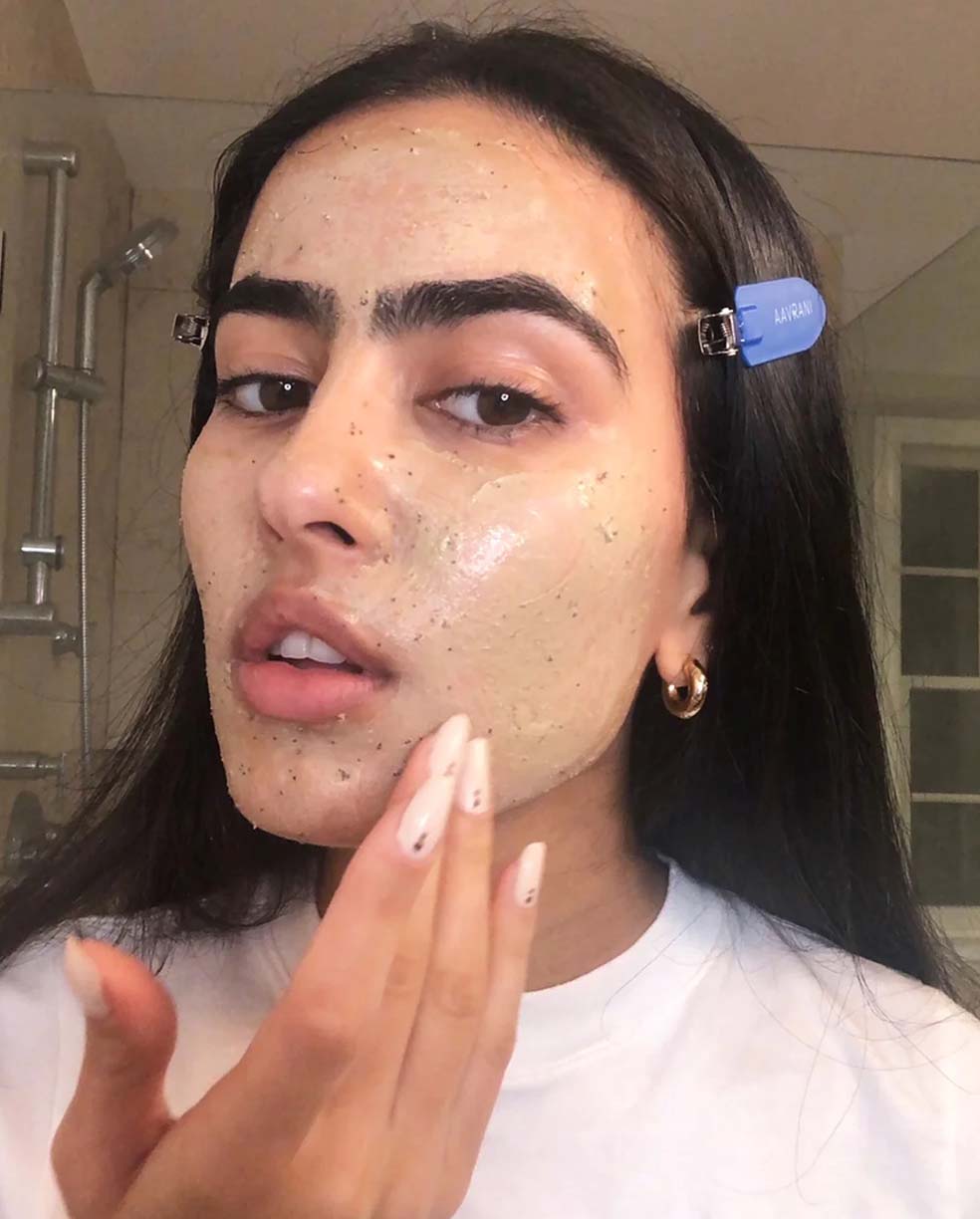AAVRANI Glow Activating Exfoliator being worn by customer