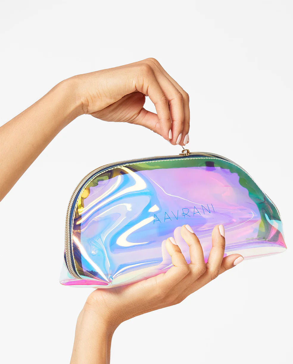 AAVRANI Holographic Bag being held by a model unzipping bag