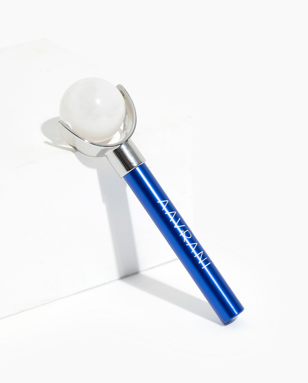 Rollmate Facial Roller againts white background