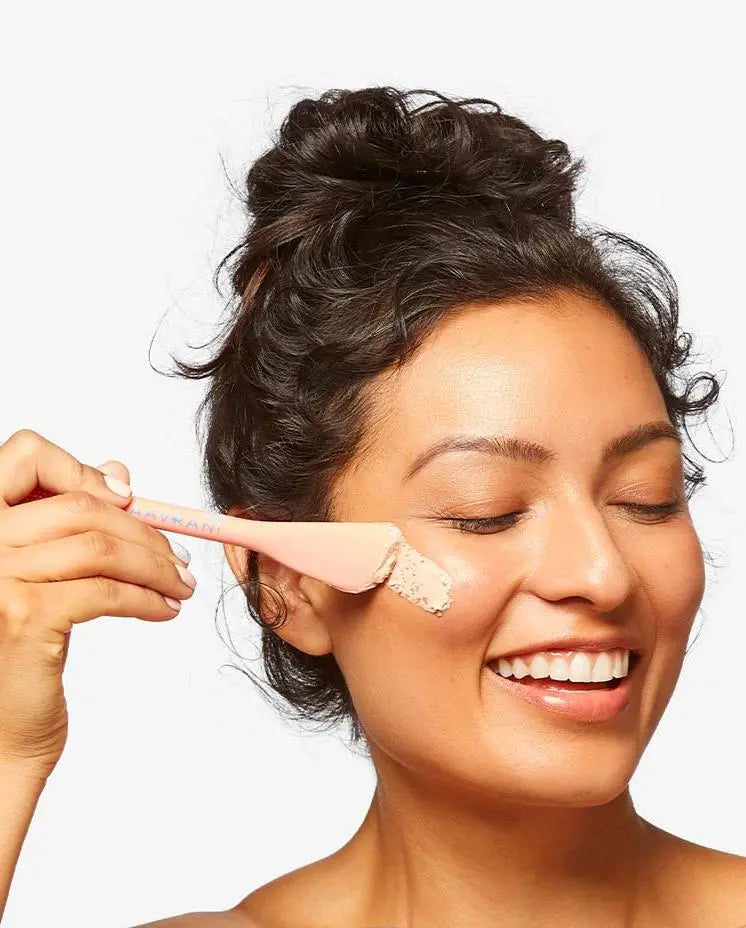 AAVRANI Mask Applicator Tool  being used by model applying healing rose clay mask