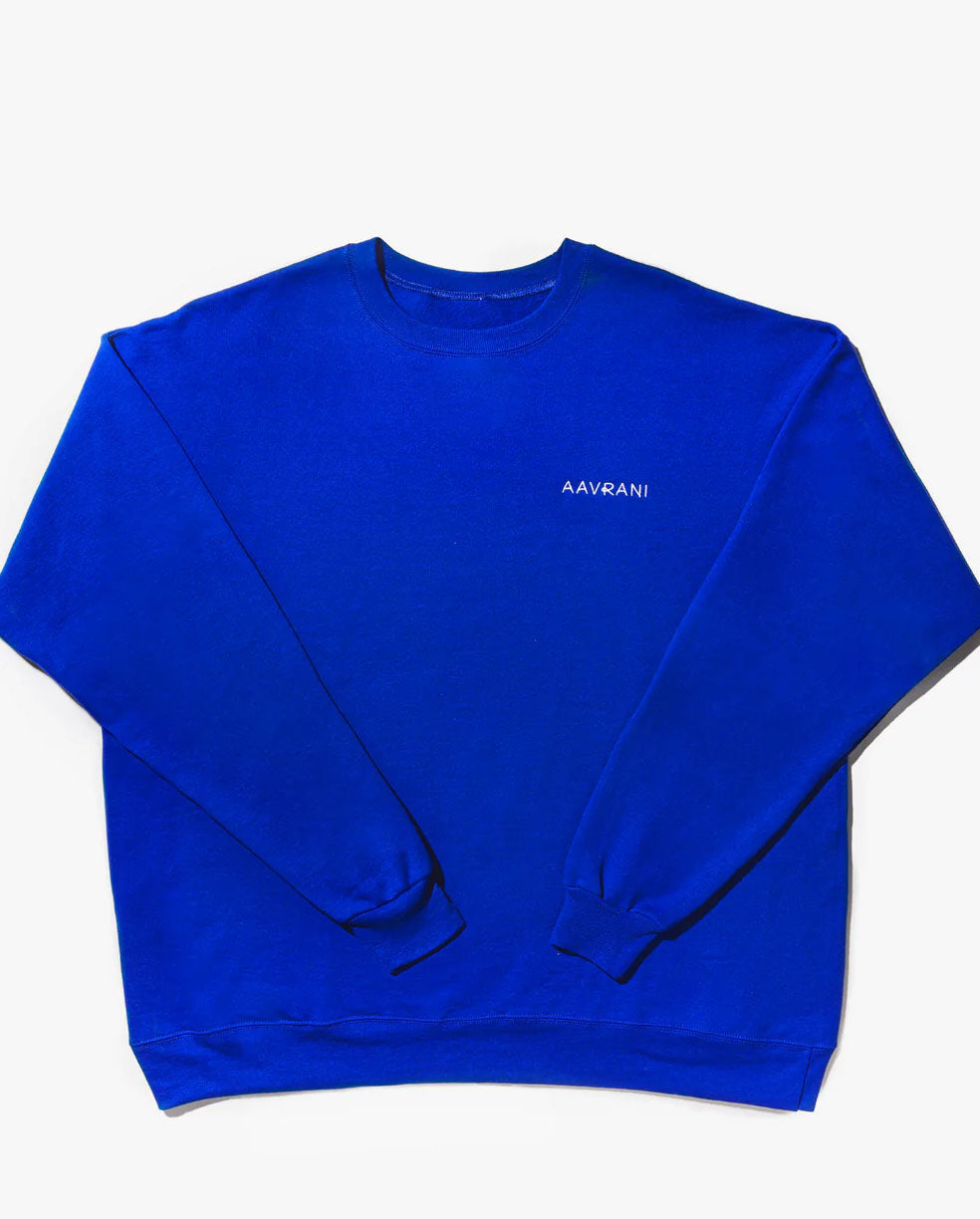 AAVRANI Hyper Blue Crewneck against grey background